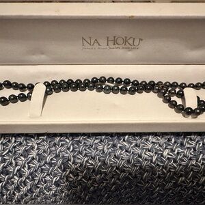 Na Hoku 12 in black pearl necklace with 14k gold butterfly hardware